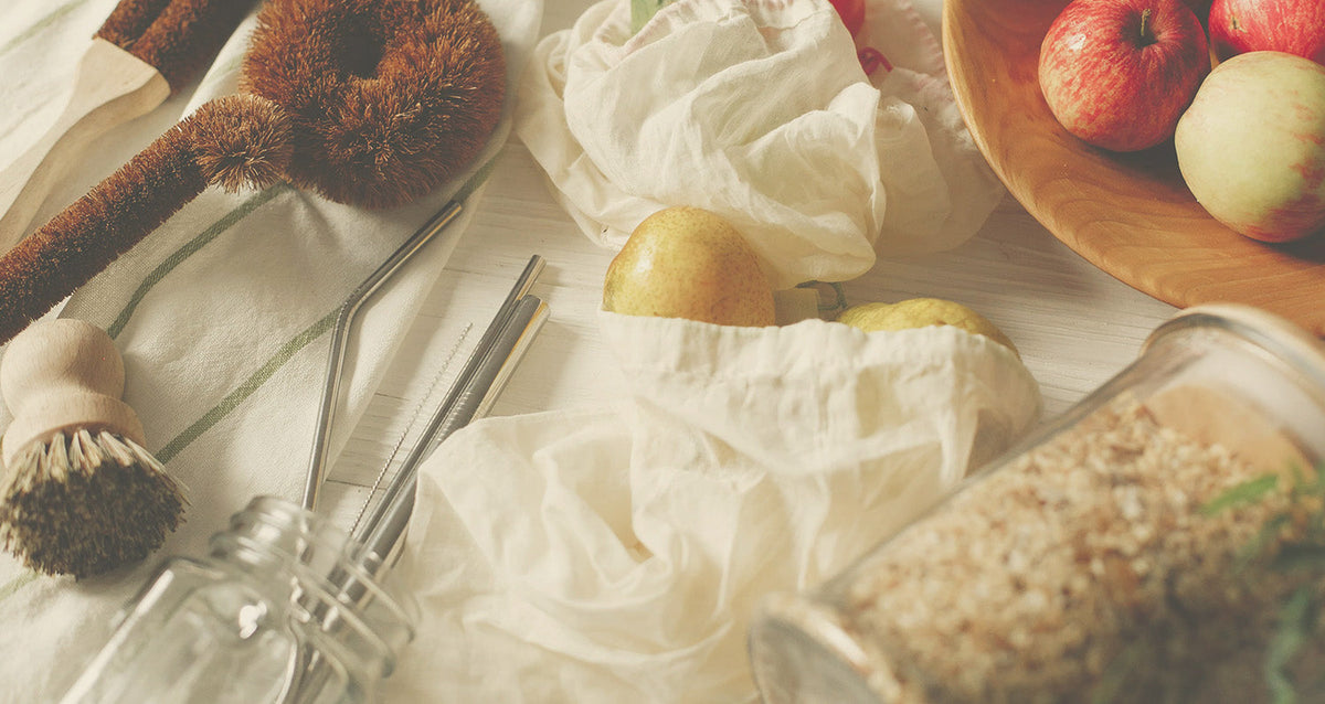 Sustainable kitchen goods and fruit on countertop.